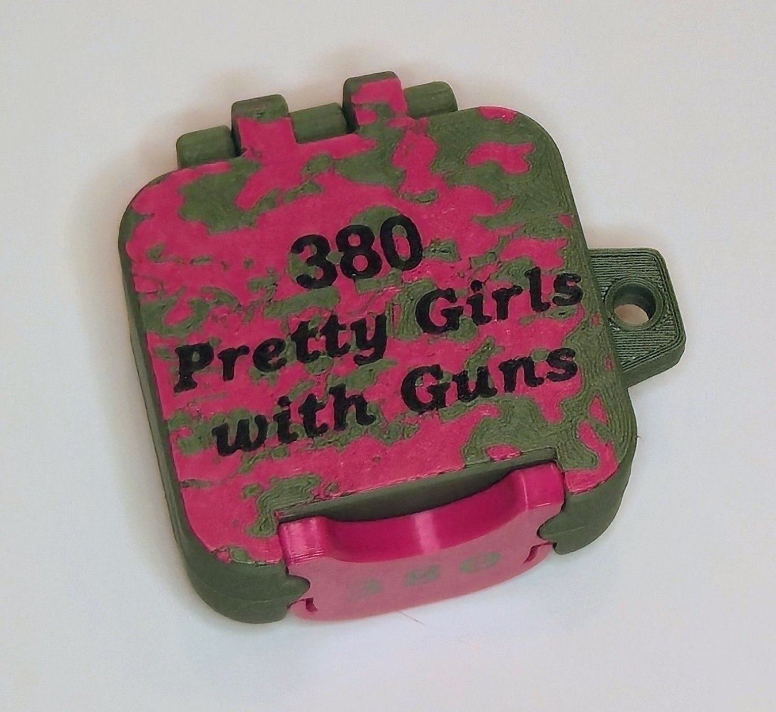 Closed BRT .380 box with pink and OD camouflage and Pretty Girls with Guns lettering