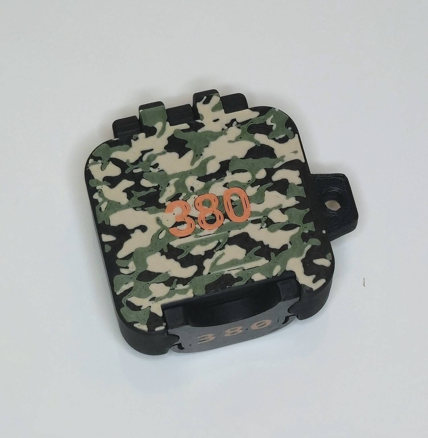 Closed BRT .380 box with woodland camouflage and orange caliber marking
