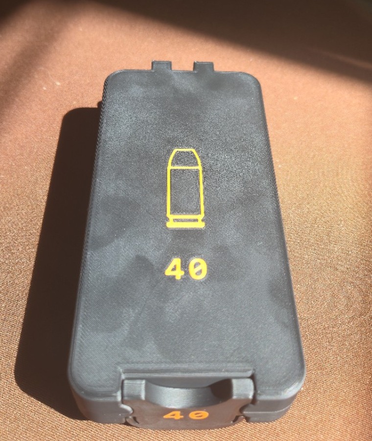 Black Bench Rest Tools 40 caliber ammunition box with orange caliber graphics